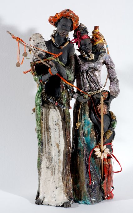 Kadounkor de Yannick Connan: deux personnages noir en costumes blancs et couleurs